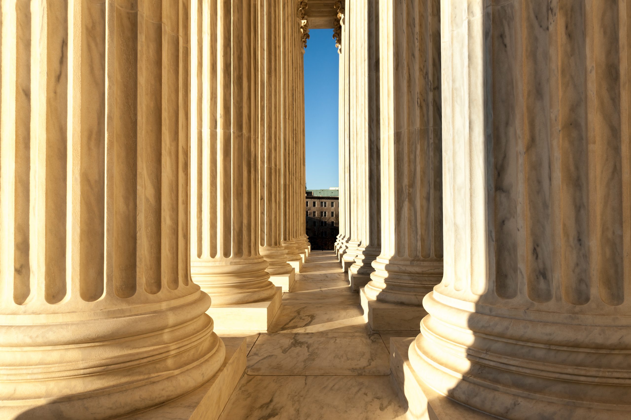 Columns in front of United States Supreme Court in Washington DC during the day